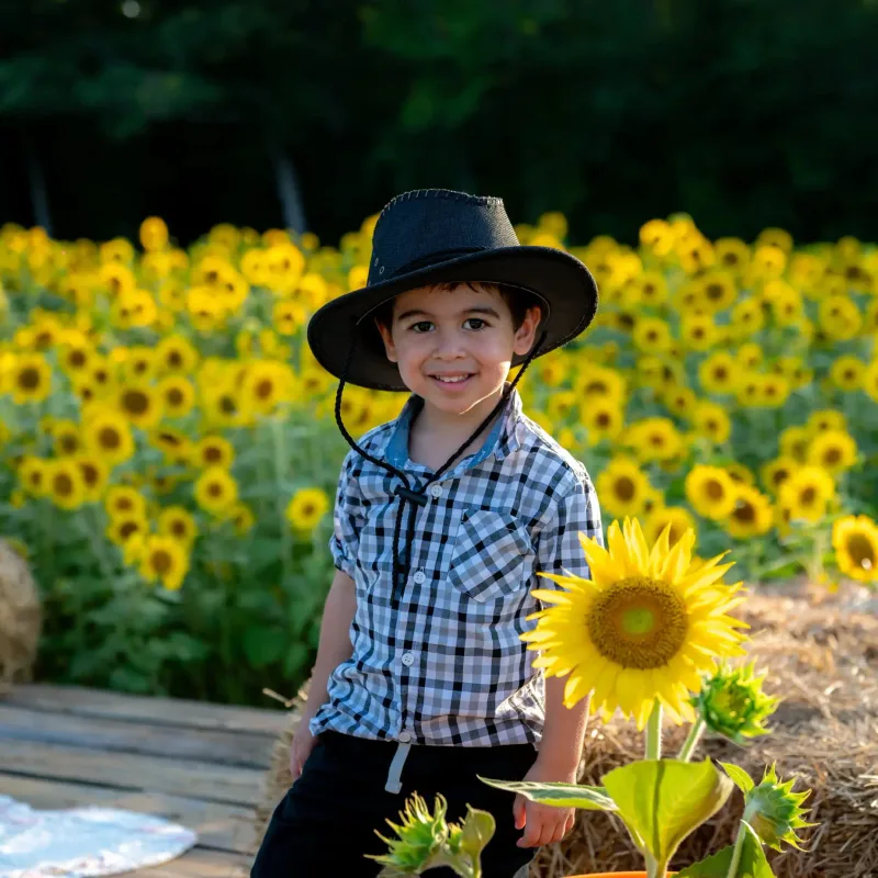 Child portrait session with sunflower setting