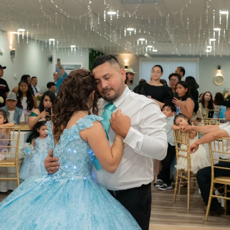 Father and daughter dance during a quinceanera celebration in Richmond VA
