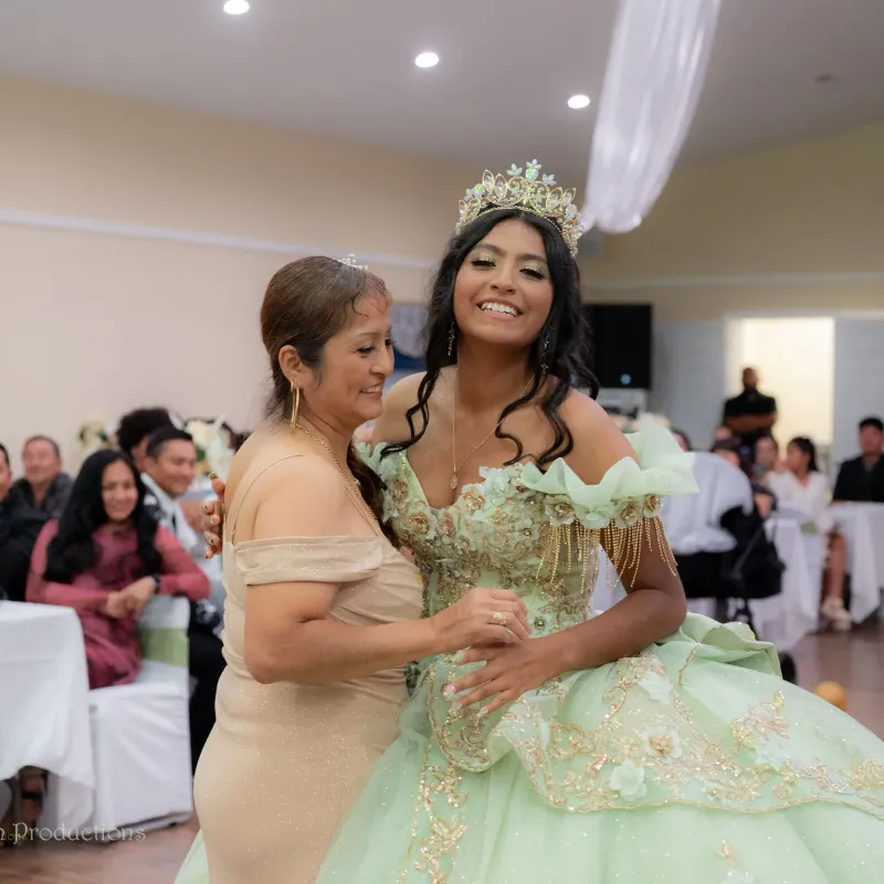 Mother and daughter dance during a quinceanera celebration