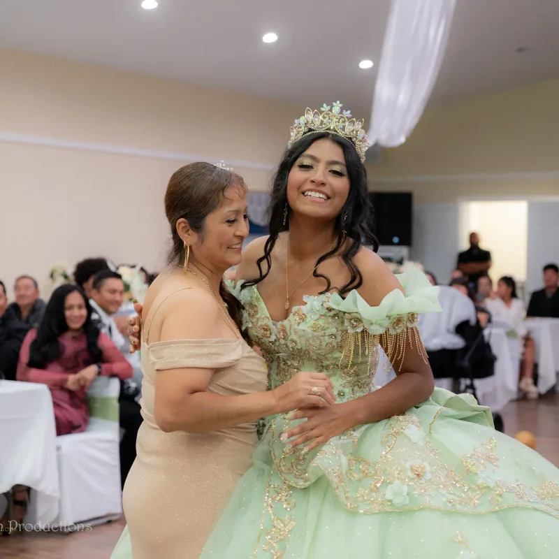 Mother and daughter dance during a quinceanera celebration