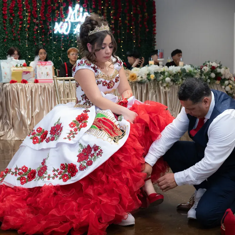 Quinceanera shoe change tradition during a family celebration