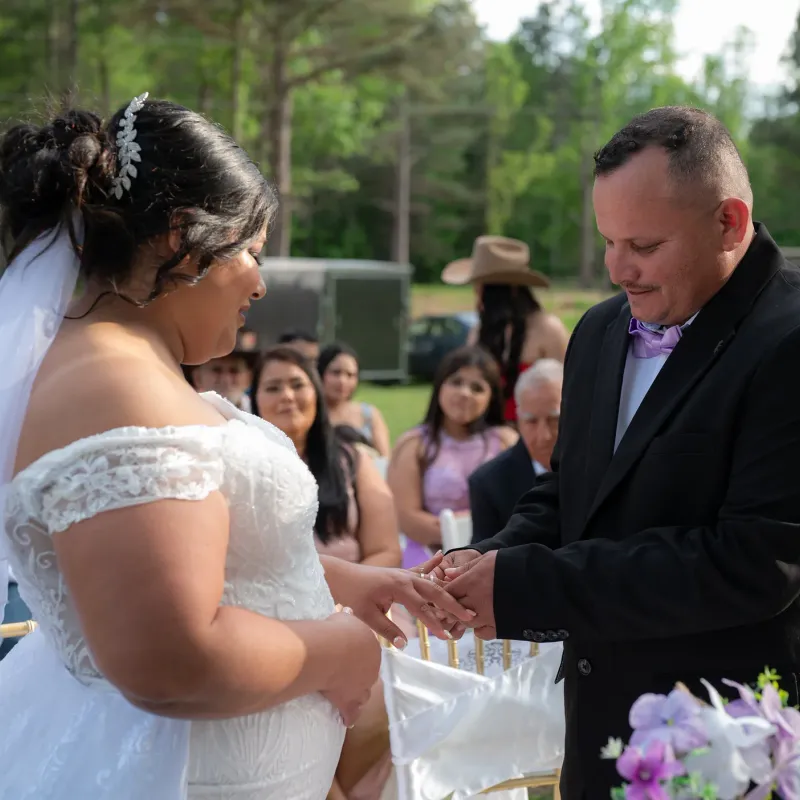 Outdoor ranch wedding ring exchange ceremony